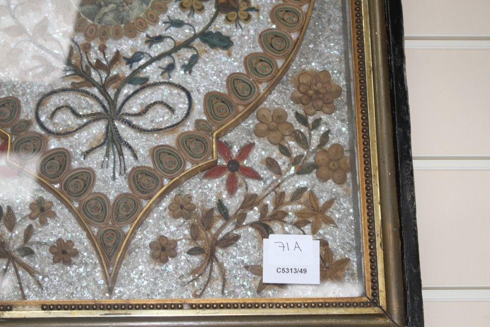 An early 19th century paper scroll work panel